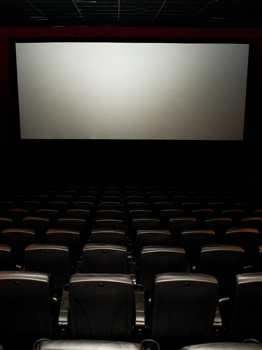 dark theater with lighted screen