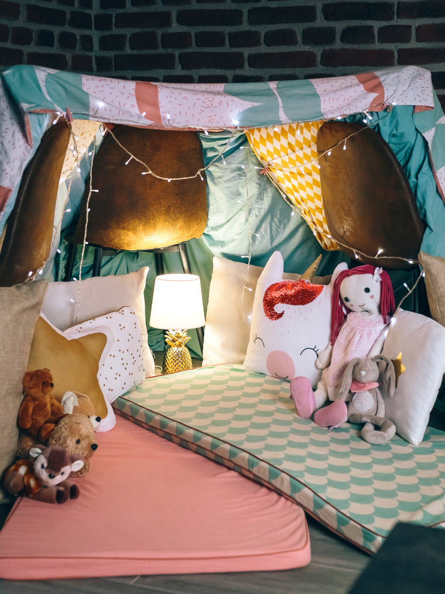 Stuffed animals in pillow fort