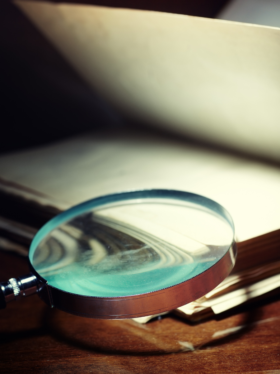 Magnifying glass on book