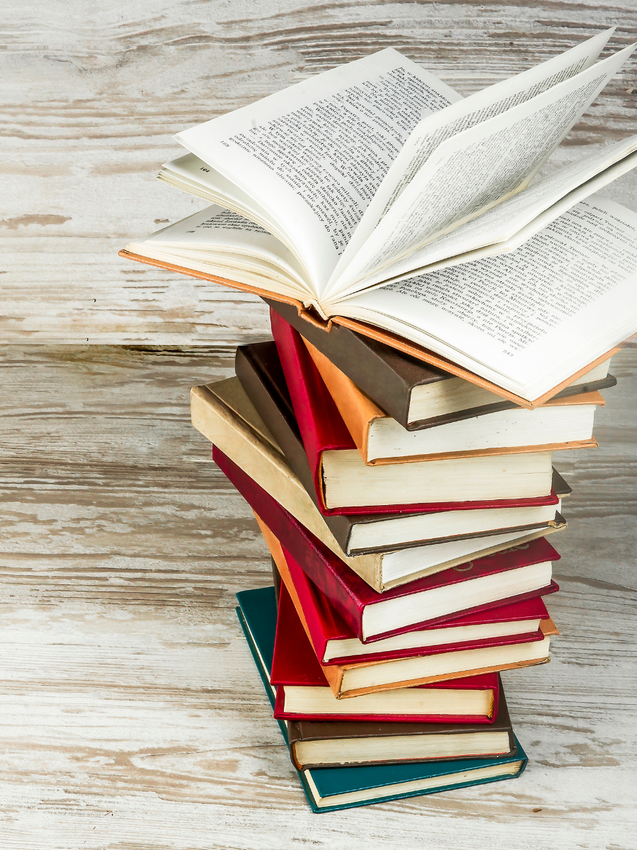 Stack of books on wooden tabletop