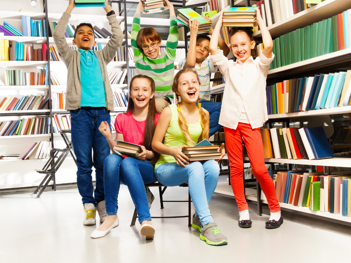 A group of excited children in a library